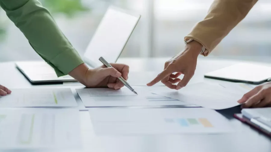 A financial team analyzes valuation data.